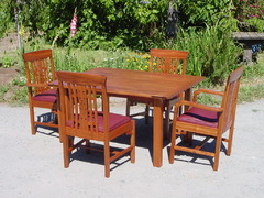 Four chairs shown with custom dining table.